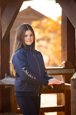 LeMieux Young Rider Elite Team Jacket Navy 12 LeMieux Young Rider Elite Team Jacket Navy -Equestrian Supplies Shop IT03172 lifestyle junioreliteteamjacket navy 1
